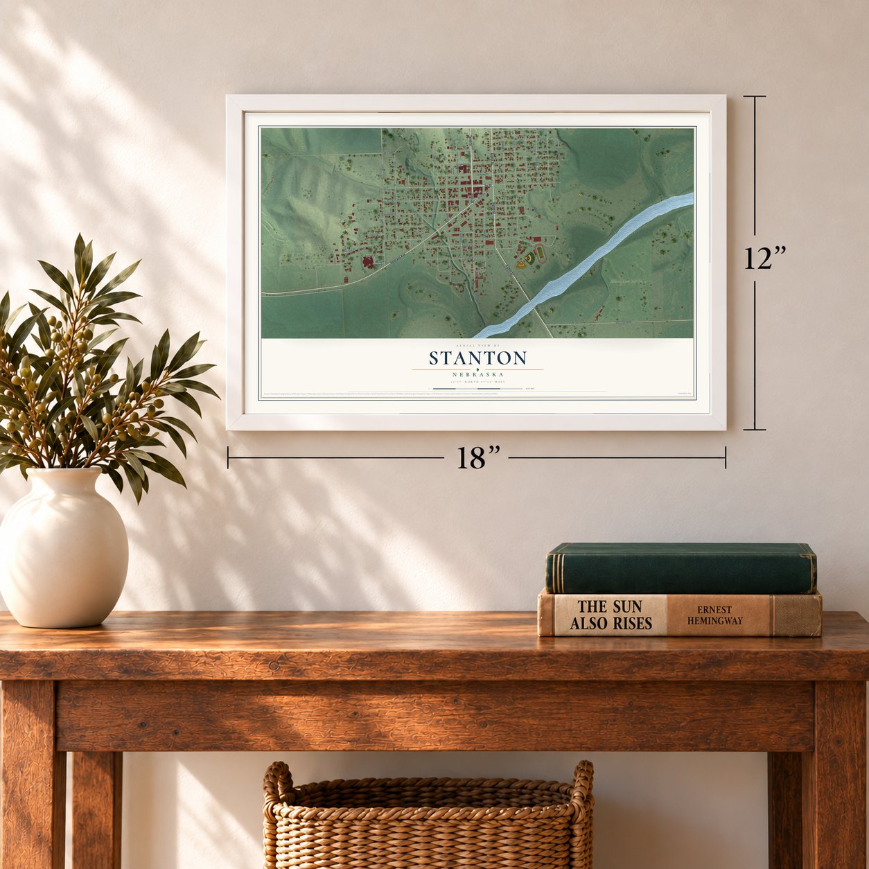 Stanton, Nebraska map, 12 x 18 inch print in a white frame in an entryway