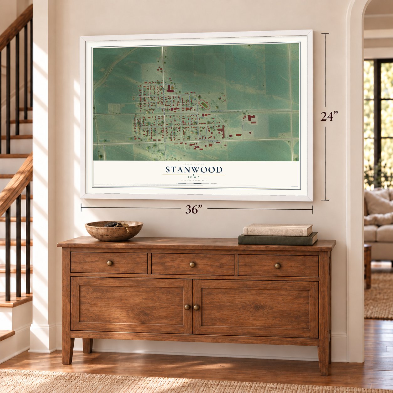 Stanwood, Iowa map, 24 x 36 inch print in a white frame above a dresser by a staircase