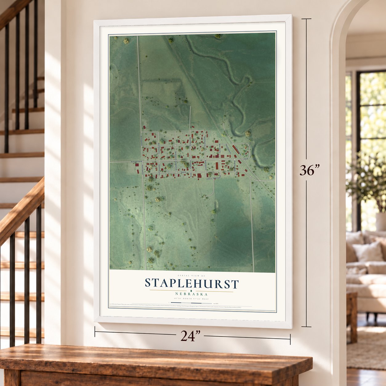 Staplehurst, Nebraska map, 24 x 36 inch print in a white frame by a staircase