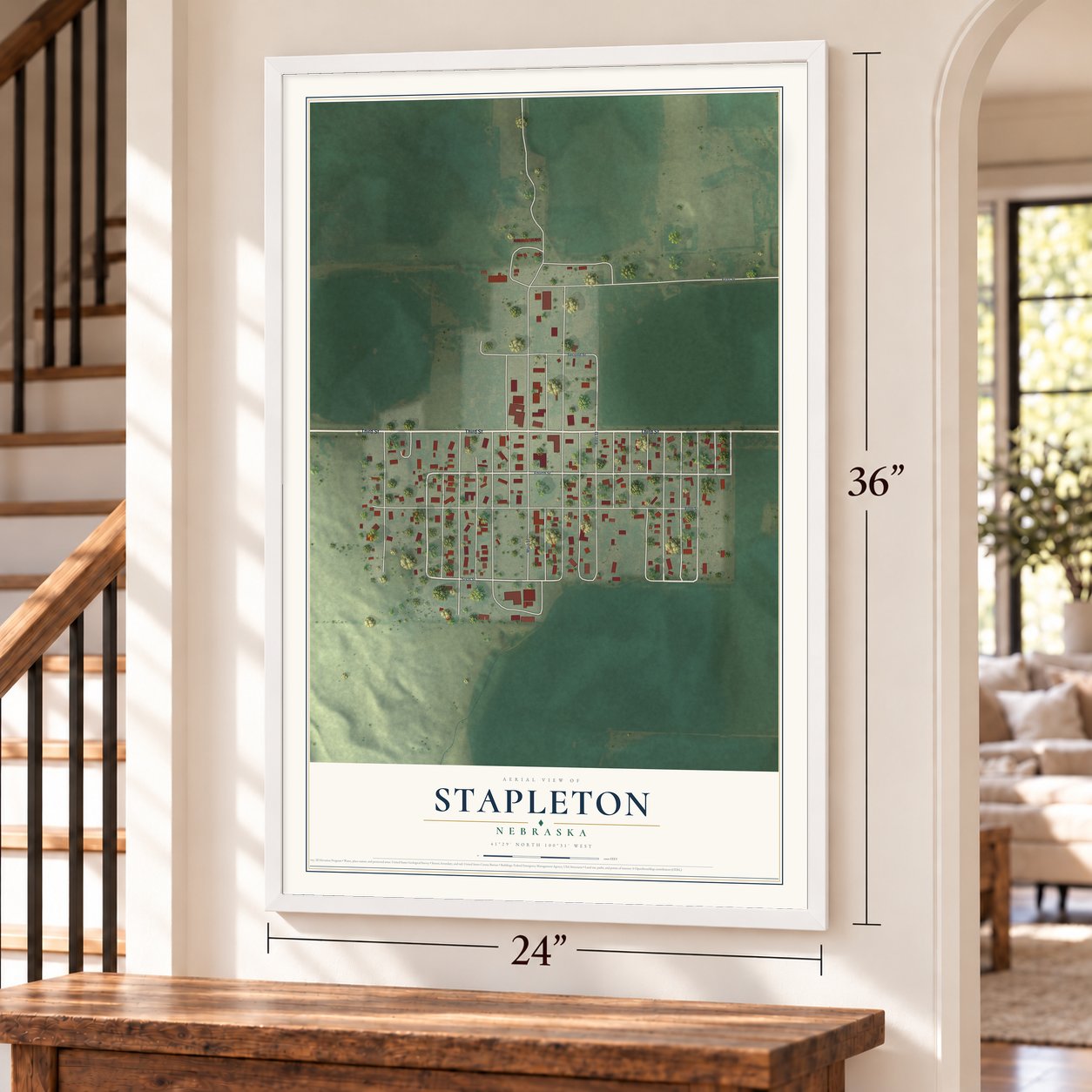 Stapleton, Nebraska map, 24 x 36 inch print in a white frame by a staircase