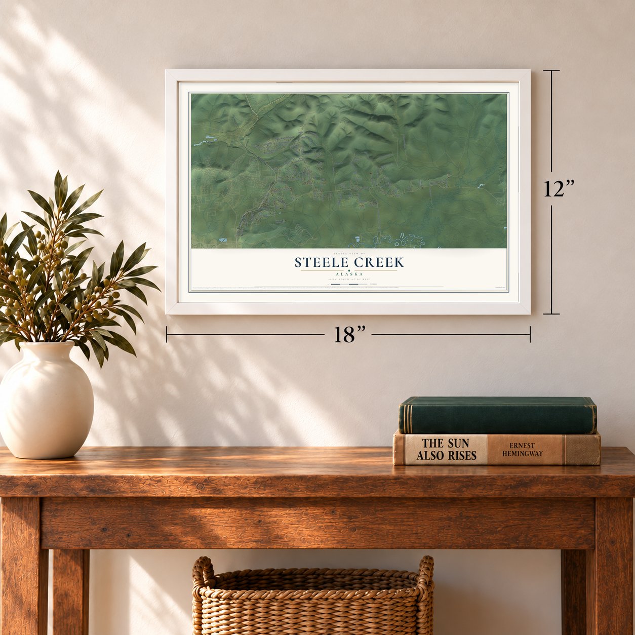 Steele Creek, Alaska map, 12 x 18 inch print in a white frame in an entryway