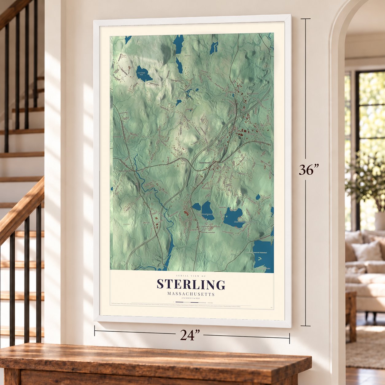Sterling, Massachusetts map, 24 x 36 inch print in a white frame by a staircase