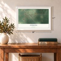 Sterling, Michigan map, 12 x 18 inch print in a white frame in an entryway