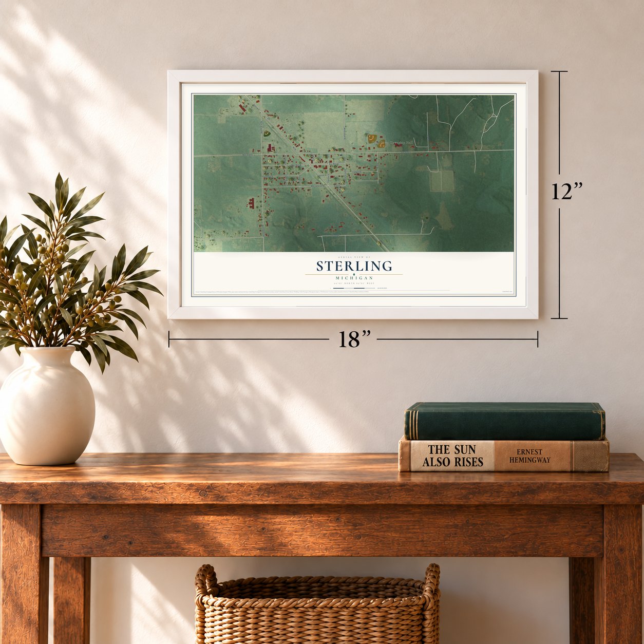 Sterling, Michigan map, 12 x 18 inch print in a white frame in an entryway
