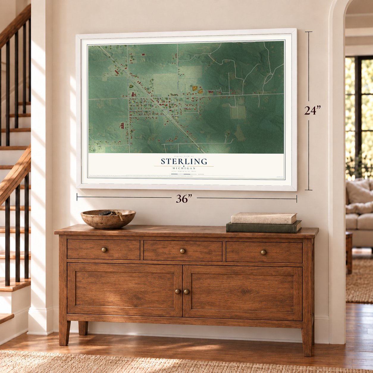 Sterling, Michigan map, 24 x 36 inch print in a white frame above a dresser by a staircase