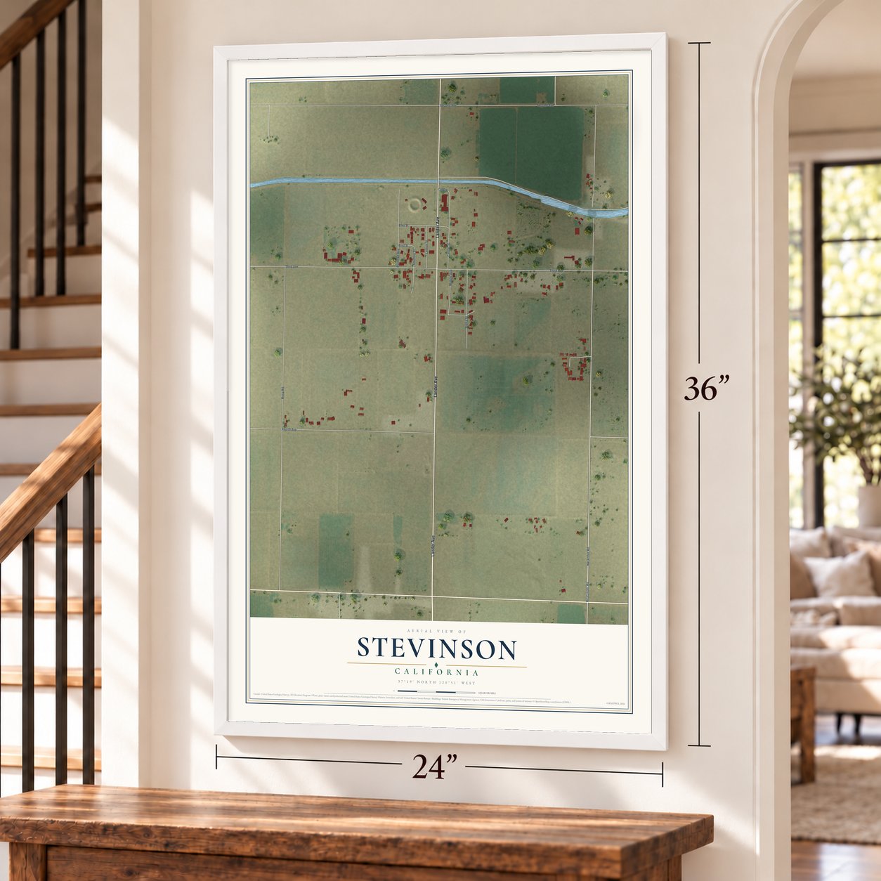 Stevinson, California map, 24 x 36 inch print in a white frame by a staircase