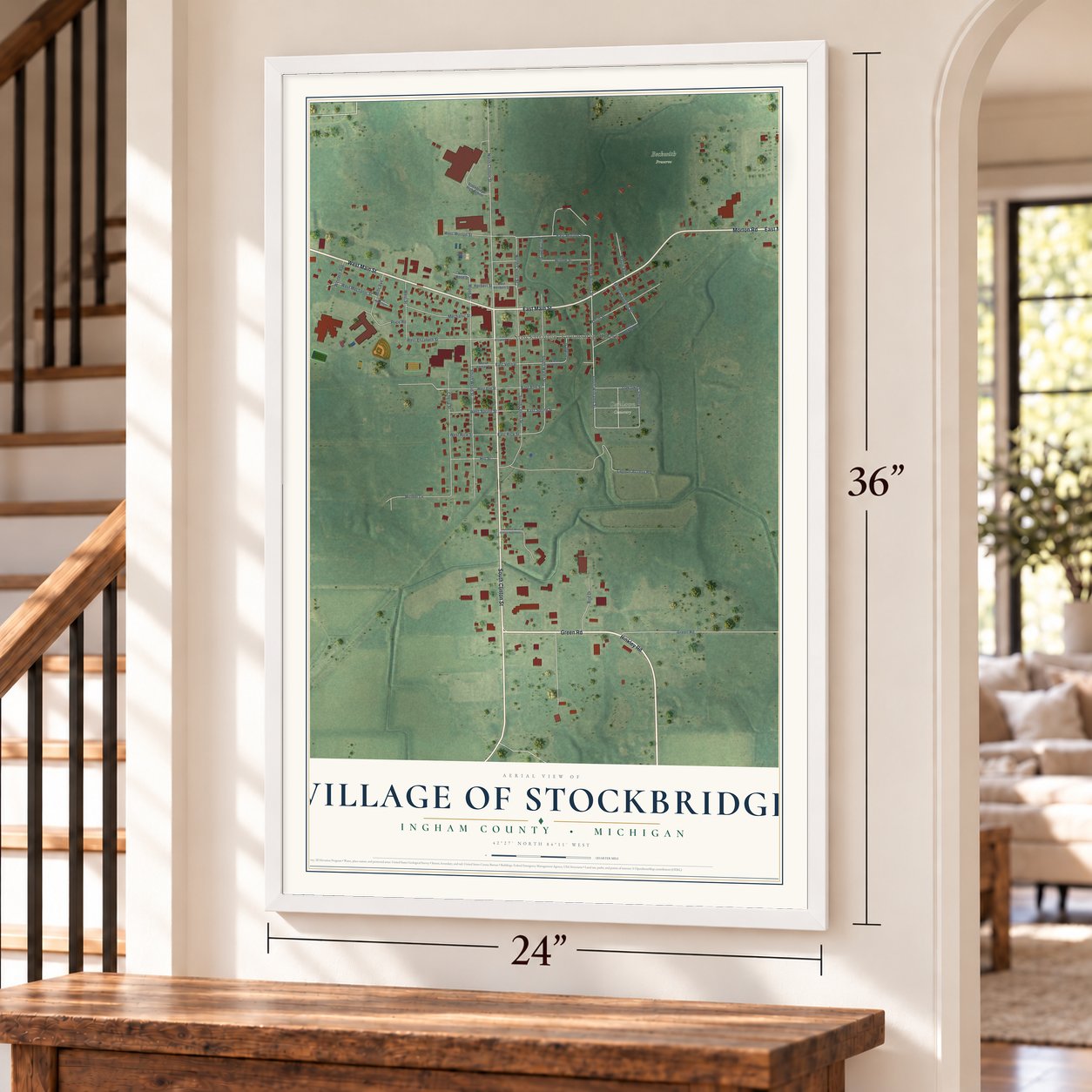 Stockbridge, Michigan map, 24 x 36 inch print in a white frame by a staircase