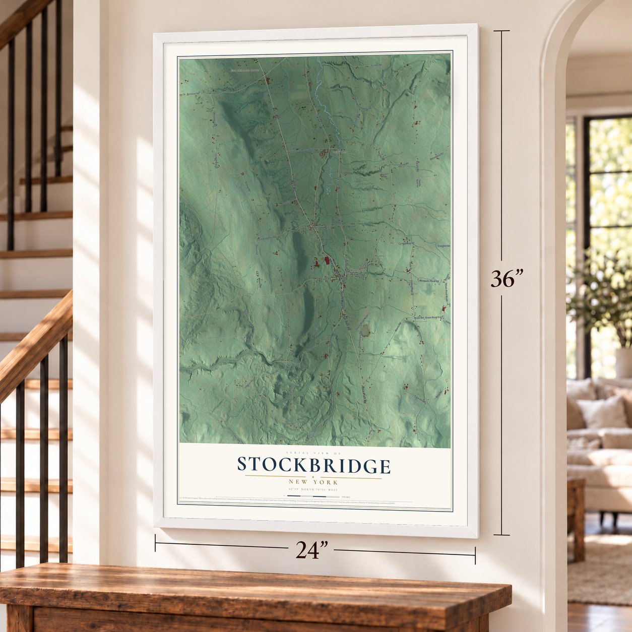 Stockbridge, New York map, 24 x 36 inch print in a white frame by a staircase