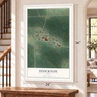 Stockton, Iowa map, 24 x 36 inch print in a white frame by a staircase