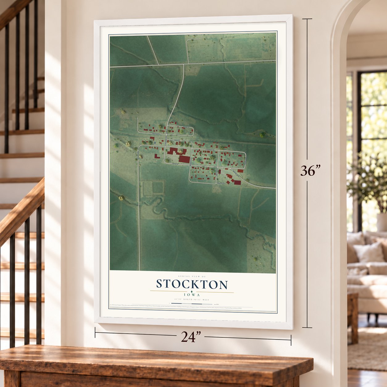 Stockton, Iowa map, 24 x 36 inch print in a white frame by a staircase