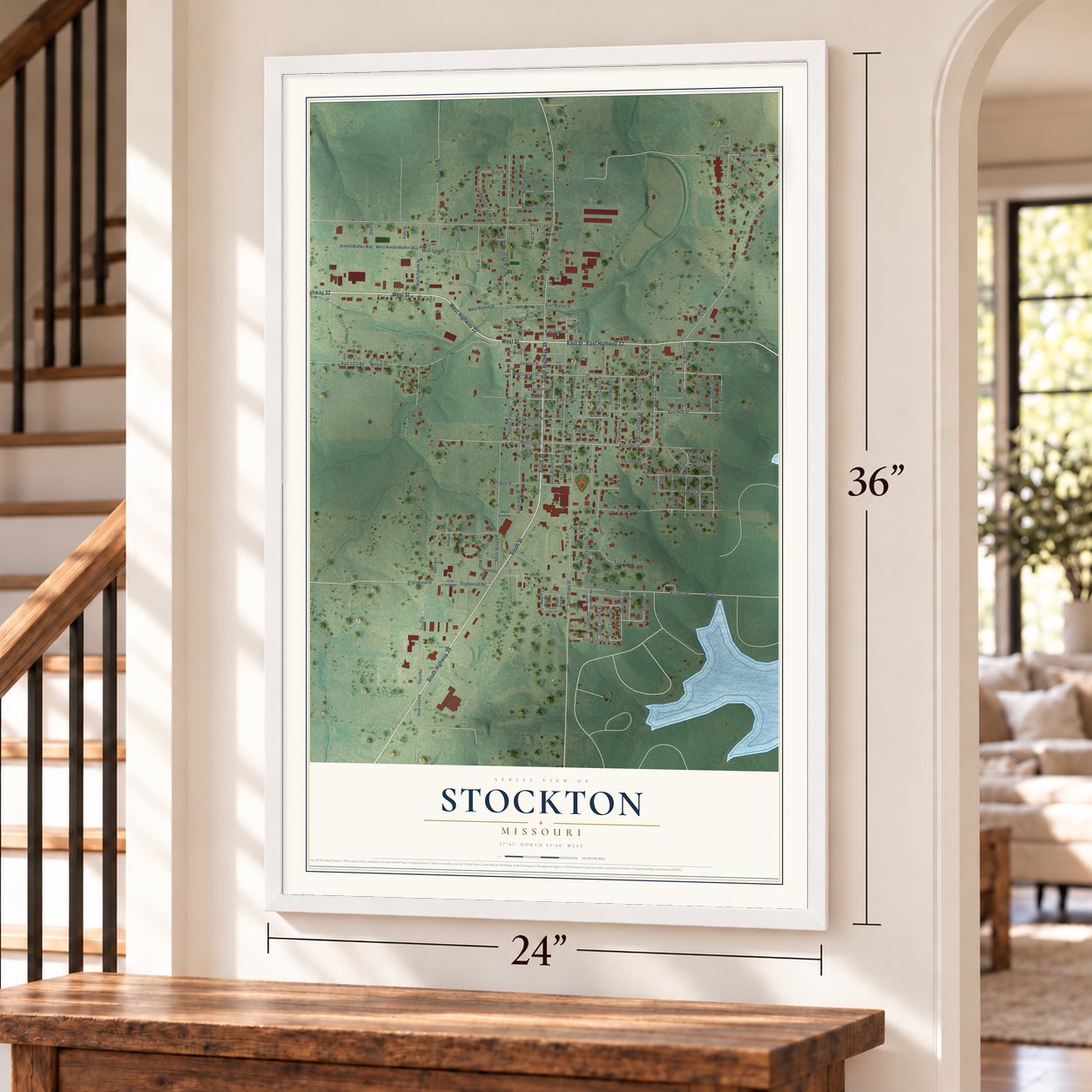 Stockton, Missouri map, 24 x 36 inch print in a white frame by a staircase
