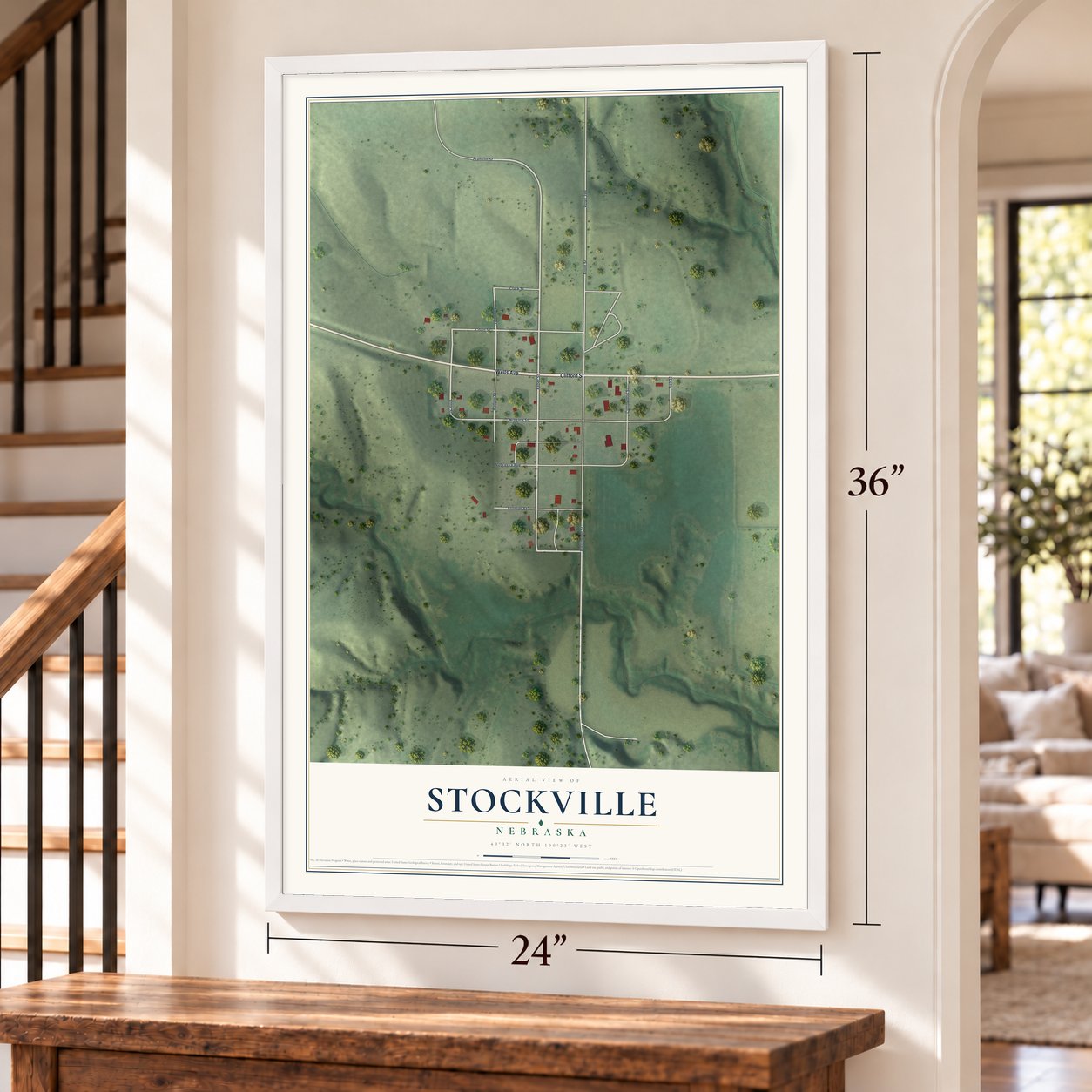 Stockville, Nebraska map, 24 x 36 inch print in a white frame by a staircase