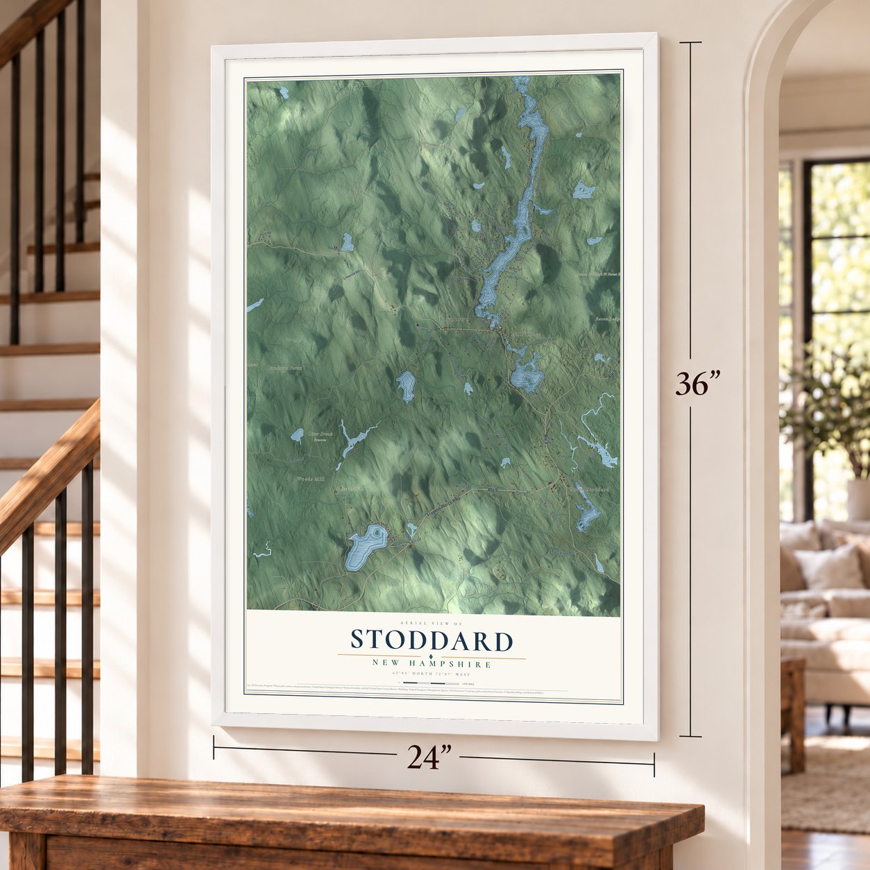 Stoddard, New Hampshire map, 24 x 36 inch print in a white frame by a staircase