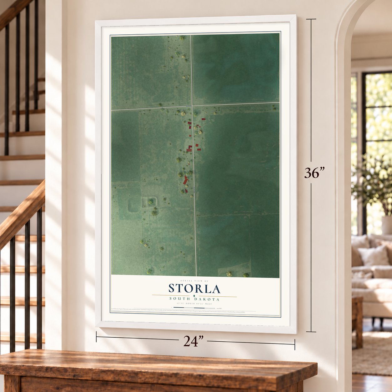 Storla, South Dakota map, 24 x 36 inch print in a white frame by a staircase