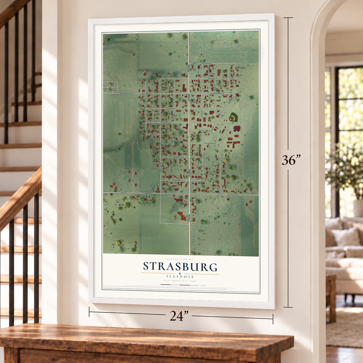 Strasburg, Illinois map, 24 x 36 inch print in a white frame by a staircase