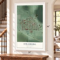Strasburg, North Dakota map, 24 x 36 inch print in a white frame by a staircase