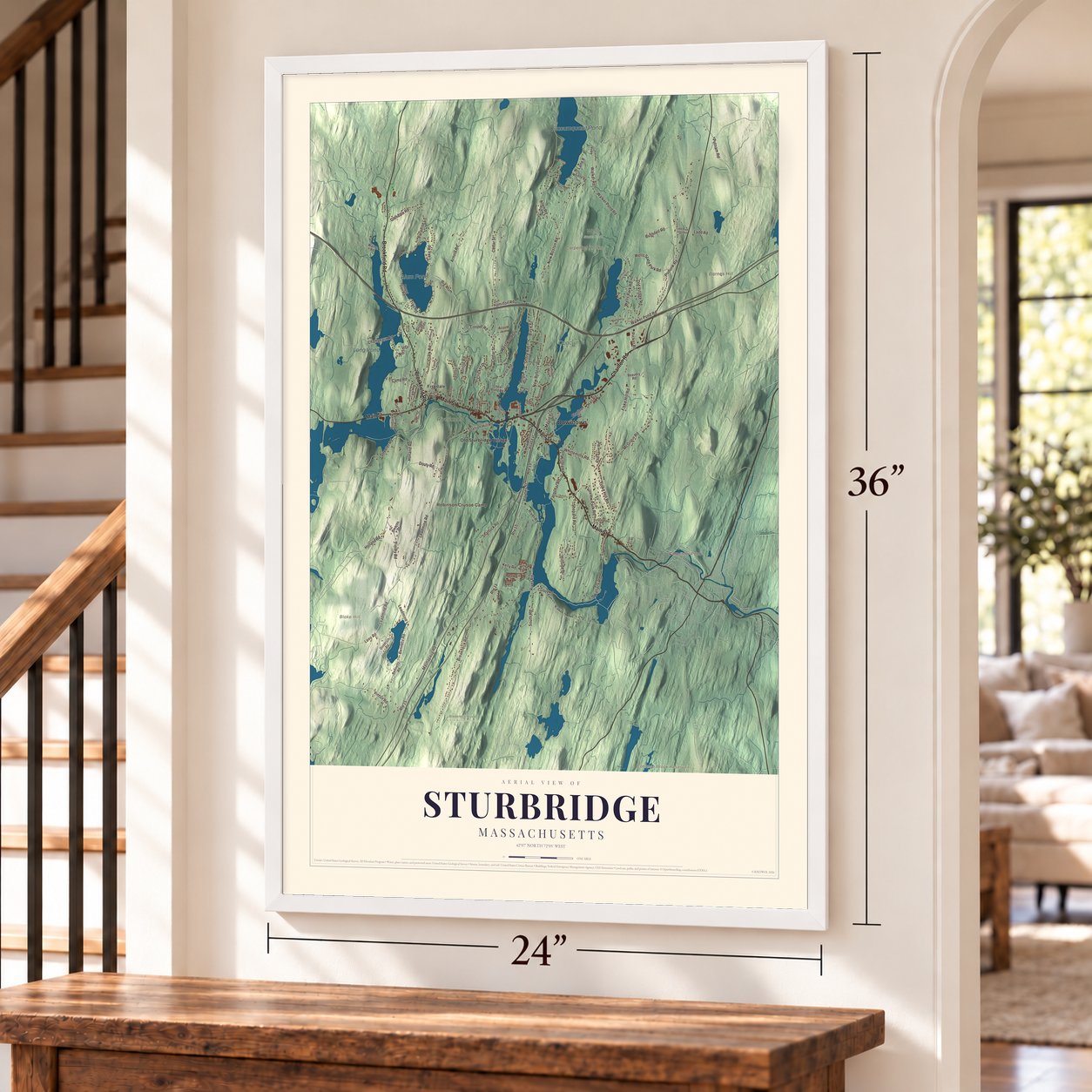 Sturbridge, Massachusetts map, 24 x 36 inch print in a white frame by a staircase