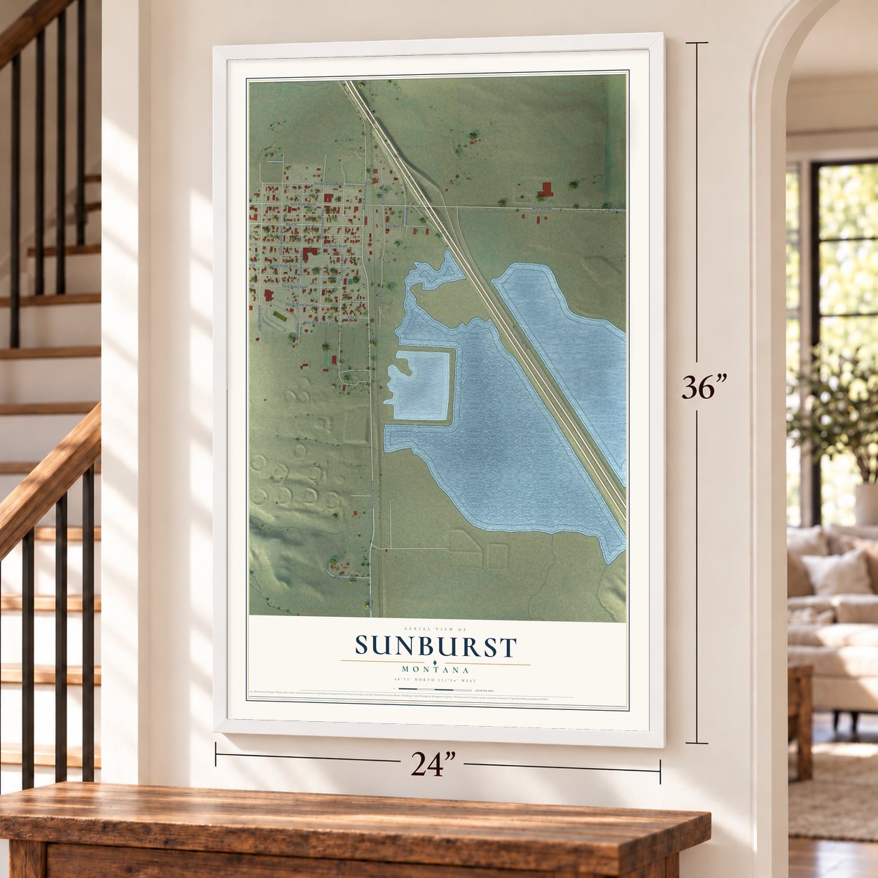 Sunburst, Montana map, 24 x 36 inch print in a white frame by a staircase