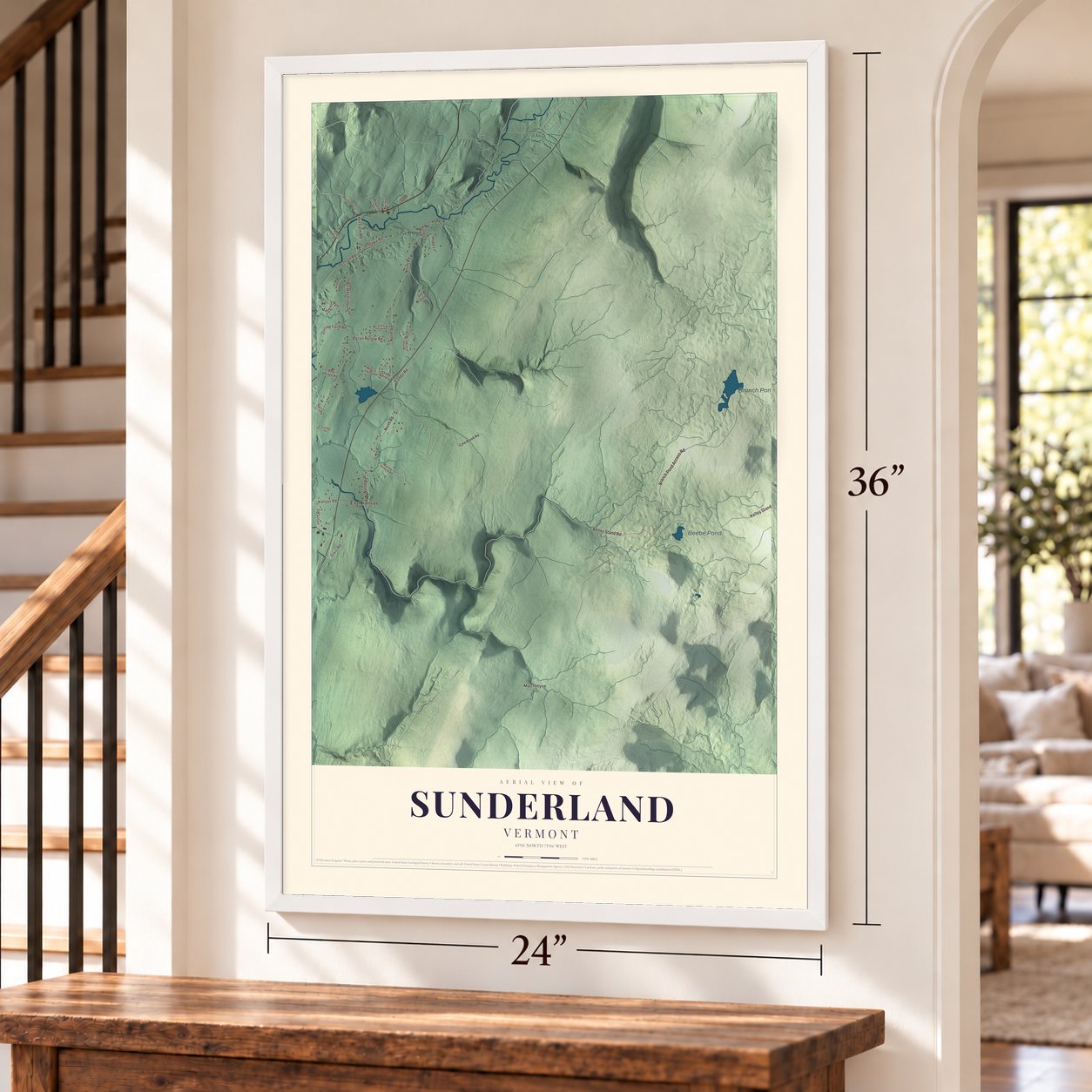 Sunderland, Vermont map, 24 x 36 inch print in a white frame by a staircase