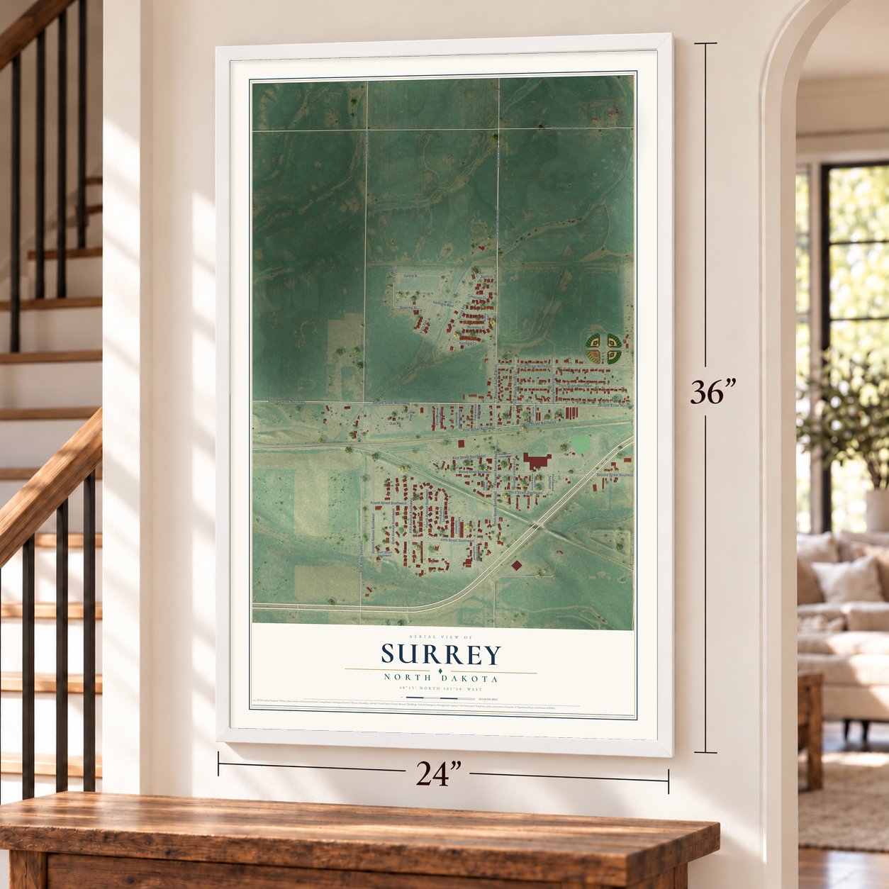 Surrey, North Dakota map, 24 x 36 inch print in a white frame by a staircase