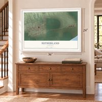 Sutherland, Nebraska map, 24 x 36 inch print in a white frame above a dresser by a staircase