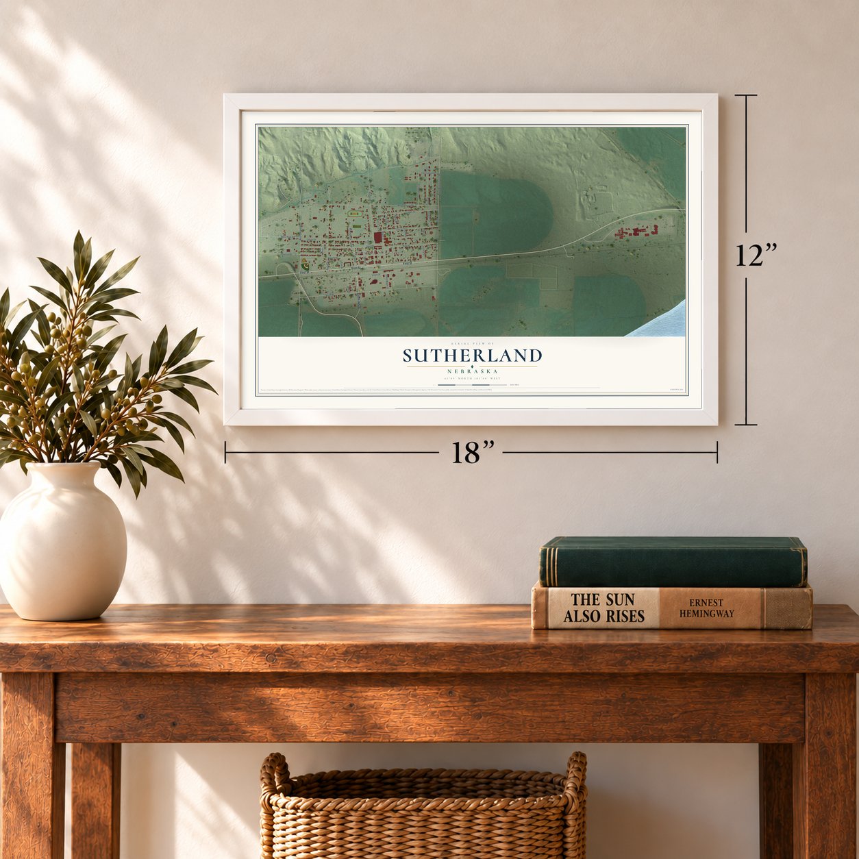 Sutherland, Nebraska map, 12 x 18 inch print in a white frame in an entryway