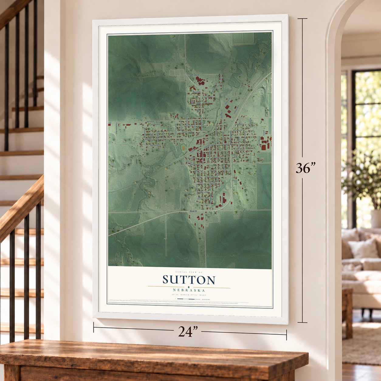 Sutton, Nebraska map, 24 x 36 inch print in a white frame by a staircase