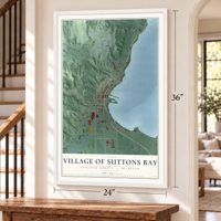 Suttons Bay, Michigan map, 24 x 36 inch print in a white frame by a staircase