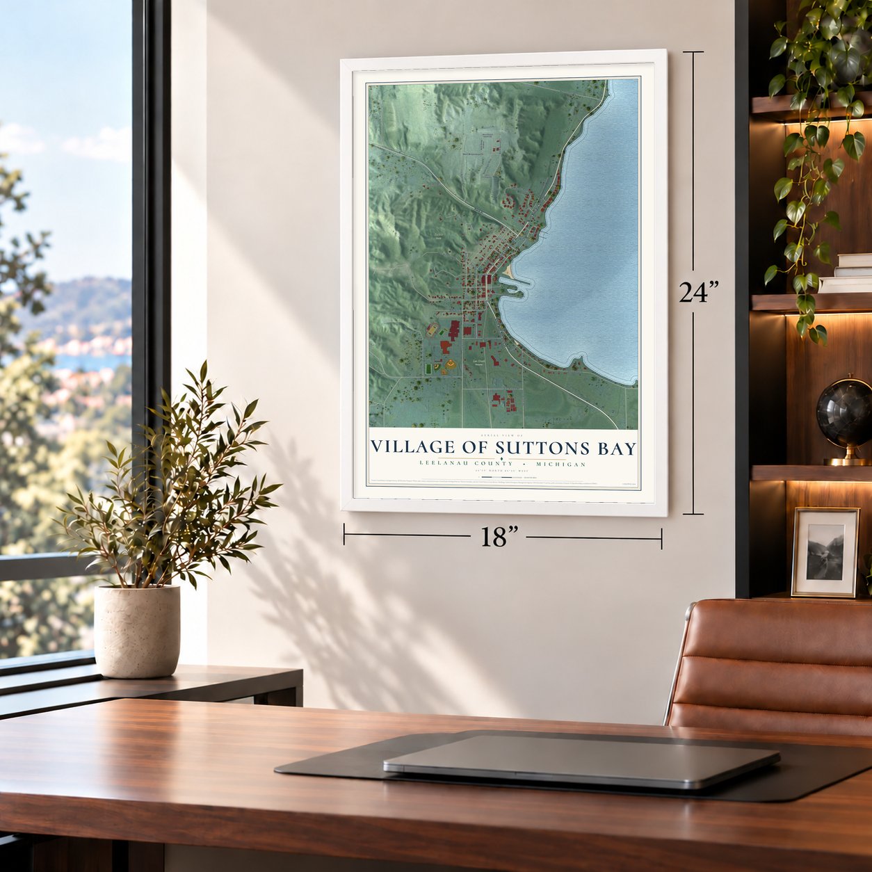 Suttons Bay, Michigan map, 18 x 24 inch print in a white frame in a home office