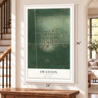 Swanton, Nebraska map, 24 x 36 inch print in a white frame by a staircase