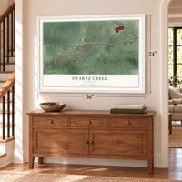 Swartz Creek, Michigan map, 24 x 36 inch print in a white frame above a dresser by a staircase