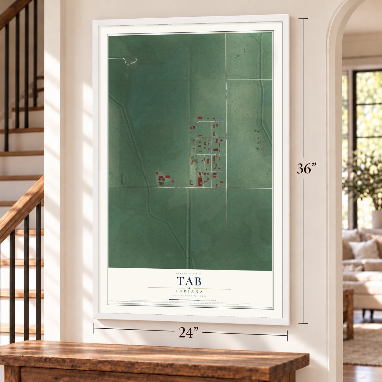 Tab, Indiana map, 24 x 36 inch print in a white frame by a staircase