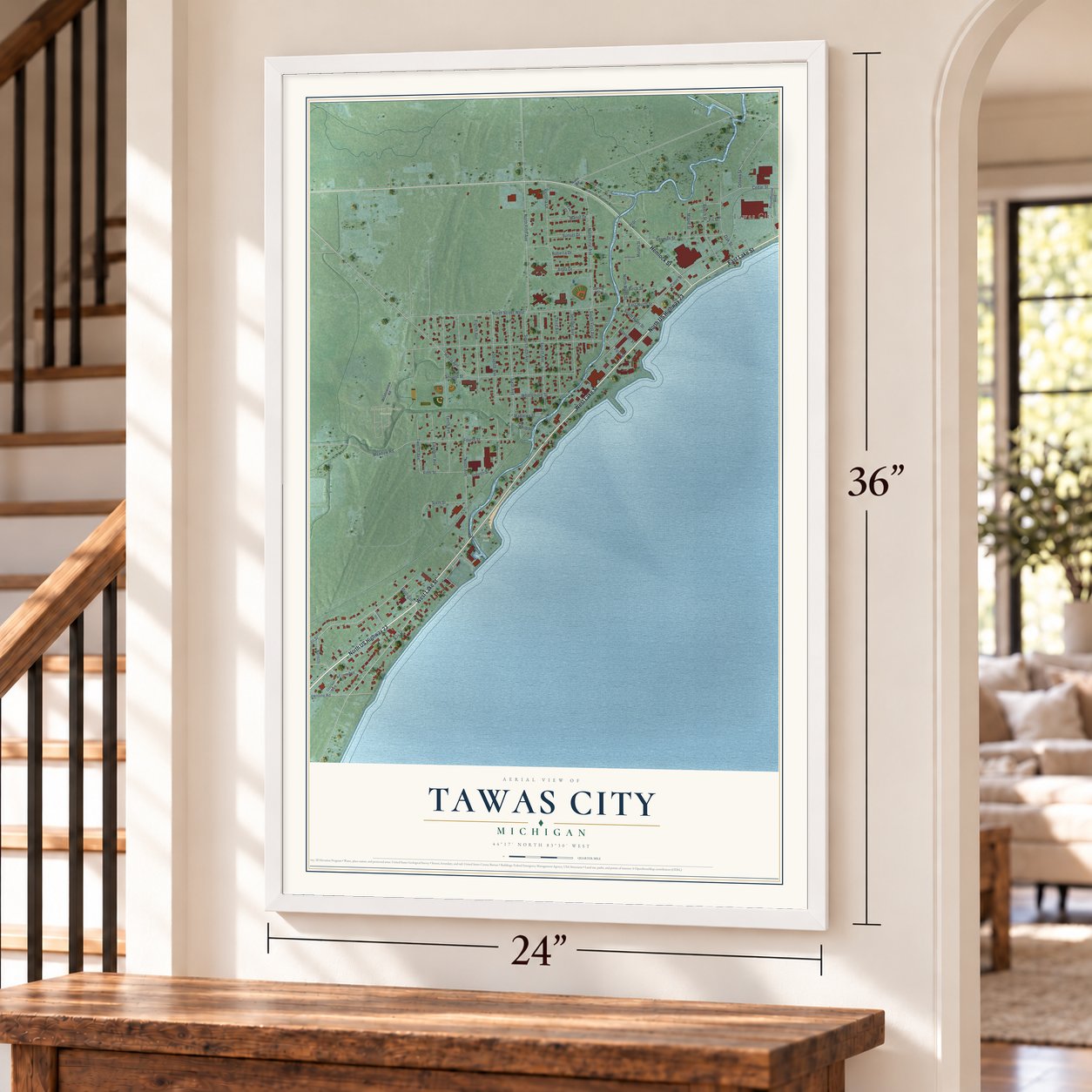 Tawas City, Michigan map, 24 x 36 inch print in a white frame by a staircase