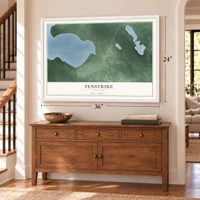 Tenstrike, Minnesota map, 24 x 36 inch print in a white frame above a dresser by a staircase