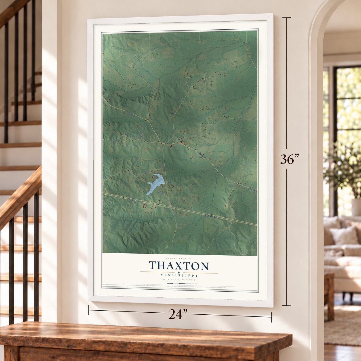 Thaxton, Mississippi map, 24 x 36 inch print in a white frame by a staircase