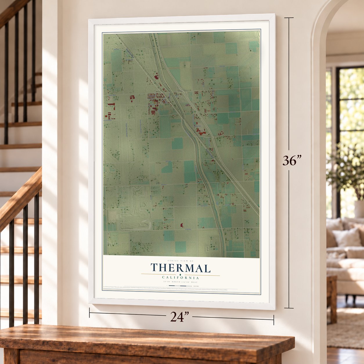 Thermal, California map, 24 x 36 inch print in a white frame by a staircase