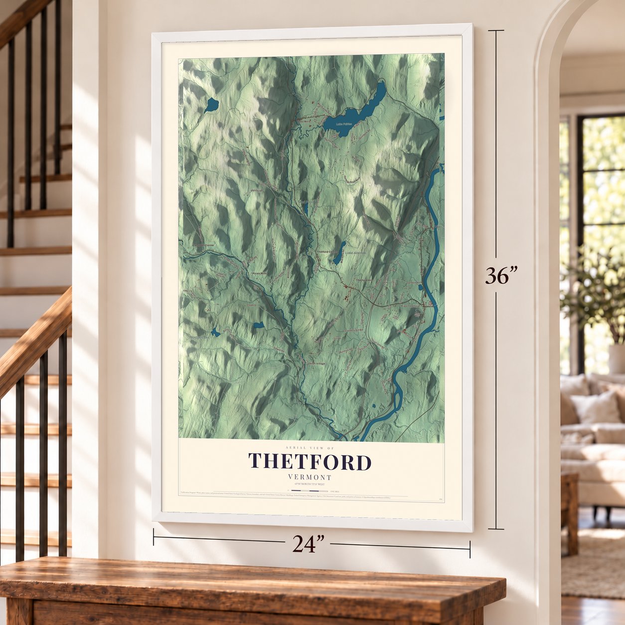 Thetford, Vermont map, 24 x 36 inch print in a white frame by a staircase