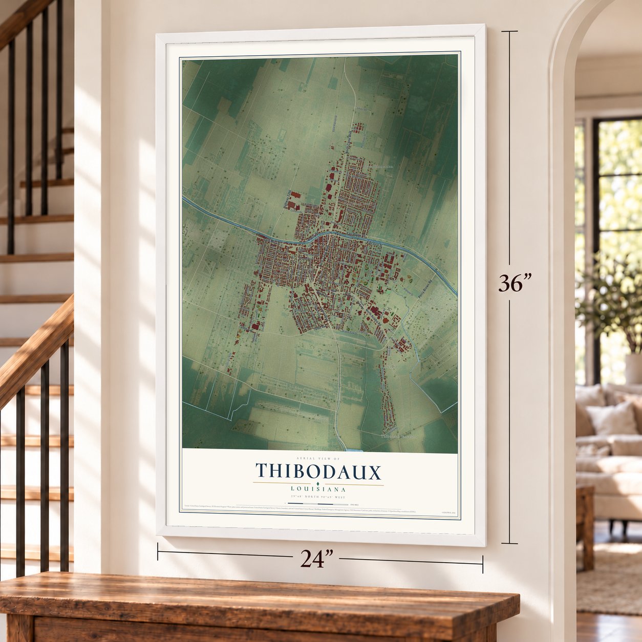 Thibodaux, Louisiana map, 24 x 36 inch print in a white frame by a staircase