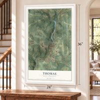 Thomas, West Virginia map, 24 x 36 inch print in a white frame by a staircase