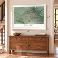 Thomaston, New York map, 24 x 36 inch print in a white frame above a dresser by a staircase