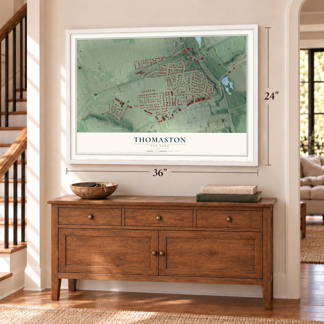 Thomaston, New York map, 24 x 36 inch print in a white frame above a dresser by a staircase
