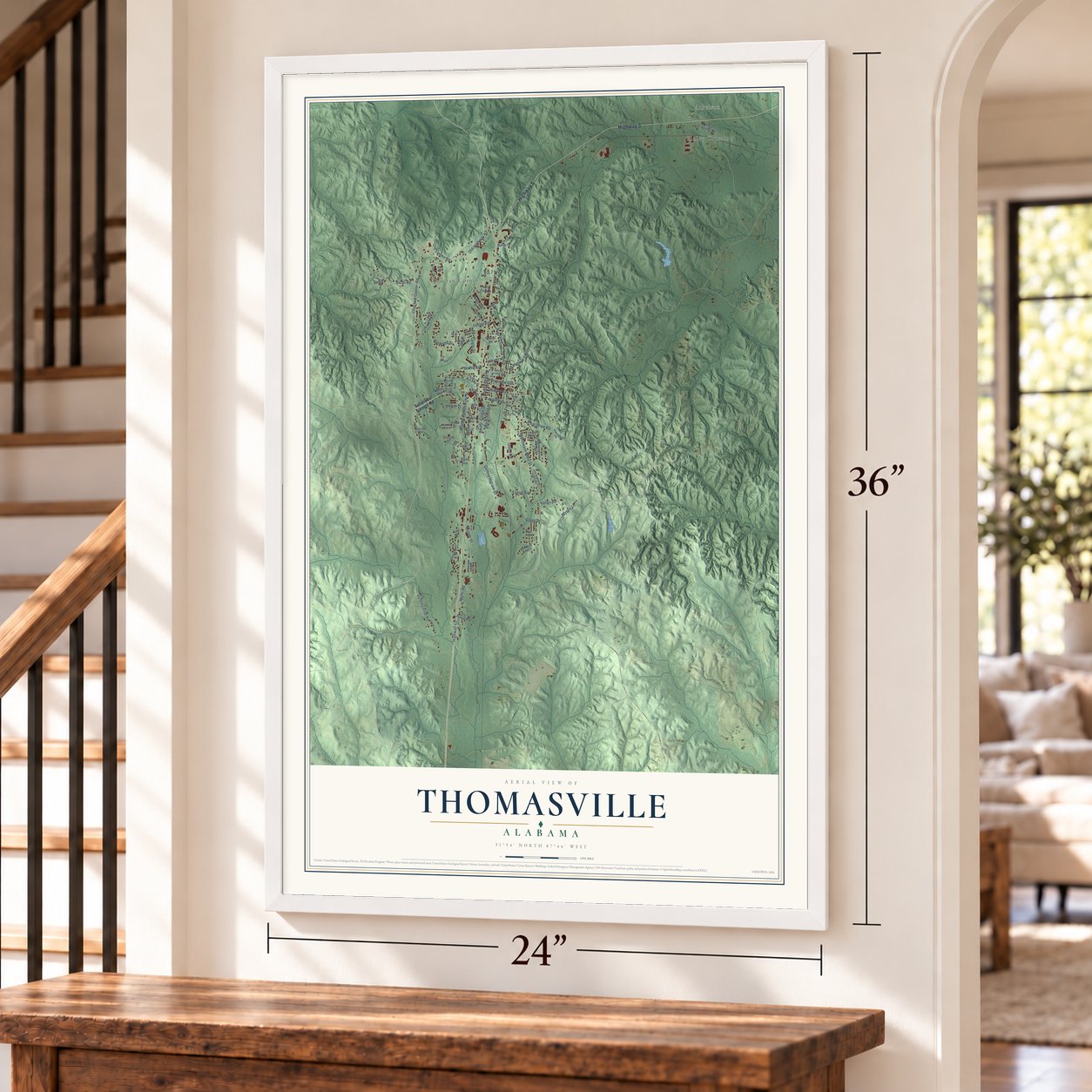 Thomasville, Alabama map, 24 x 36 inch print in a white frame by a staircase