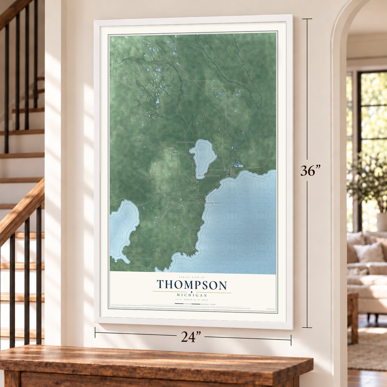 Thompson, Michigan map, 24 x 36 inch print in a white frame by a staircase