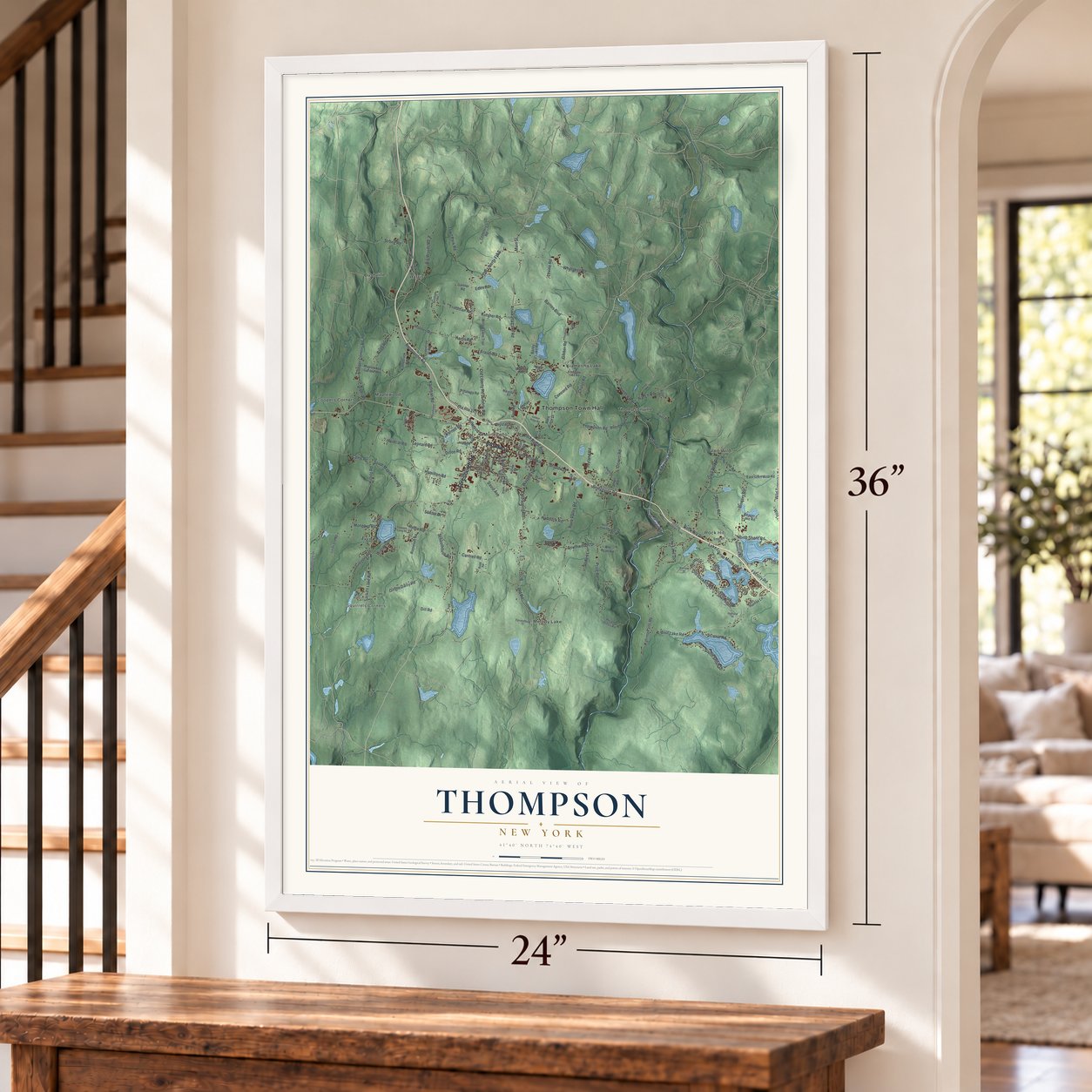 Thompson, New York map, 24 x 36 inch print in a white frame by a staircase