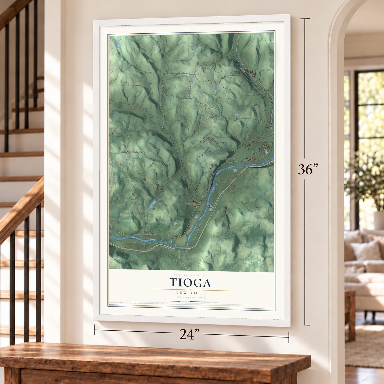 Tioga, New York map, 24 x 36 inch print in a white frame by a staircase