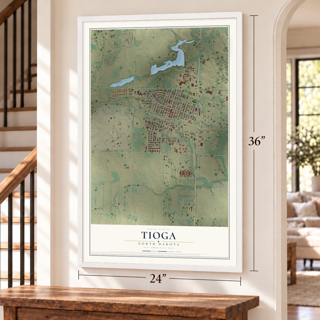 Tioga, North Dakota map, 24 x 36 inch print in a white frame by a staircase