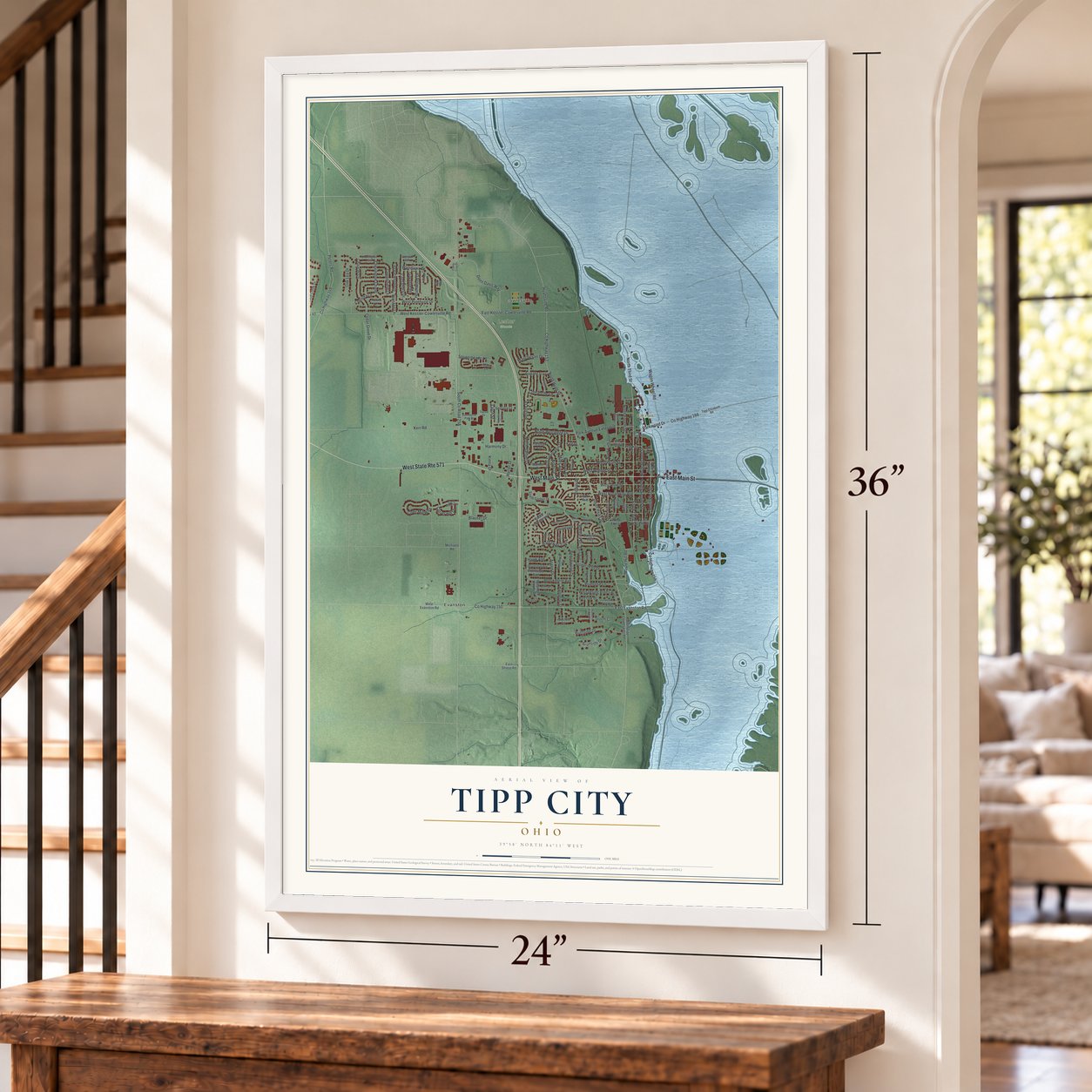 Tipp City, Ohio map, 24 x 36 inch print in a white frame by a staircase