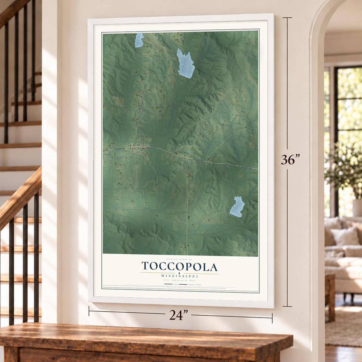 Toccopola, Mississippi map, 24 x 36 inch print in a white frame by a staircase