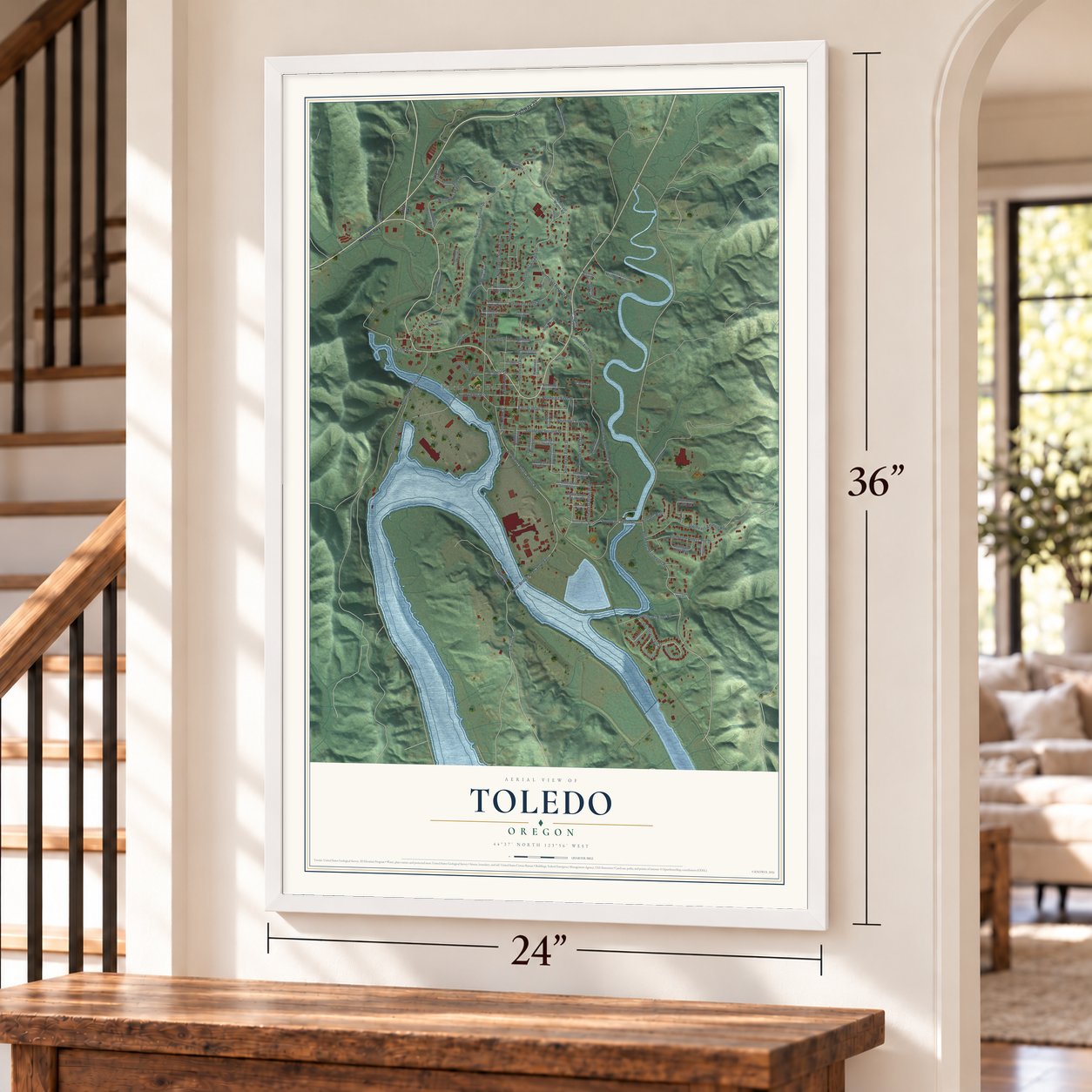 Toledo, Oregon map, 24 x 36 inch print in a white frame by a staircase