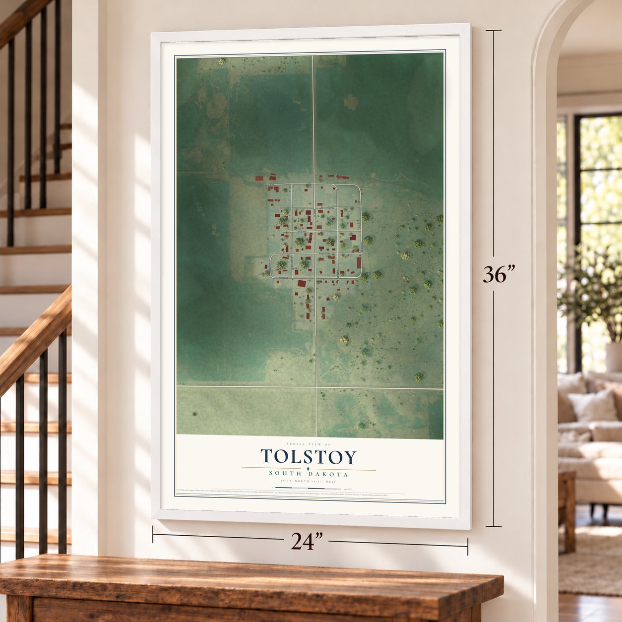 Tolstoy, South Dakota map, 24 x 36 inch print in a white frame by a staircase